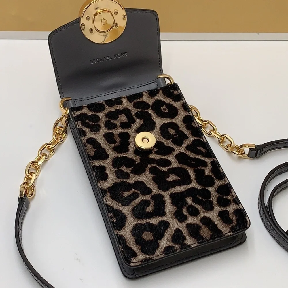 Brand New with Tag
Michael Kors Carmen Small NS Phone XBODY HairCalf Gre… - Picture 9 of 16